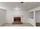 Cozy living room with a red brick fireplace with mantel and neutral carpeting at 921 Dunagan Way, Lawrenceville, GA 30045