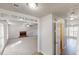 Open-concept living room with a brick fireplace and large windows allowing ample light at 921 Dunagan Way, Lawrenceville, GA 30045