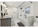 Bathroom with double sinks, a modern tub-shower, and chic fixtures at 1090 Indale Sw Pl, Atlanta, GA 30310