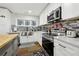 Updated kitchen featuring stainless steel appliances, granite counters, and a stylish backsplash at 1090 Indale Sw Pl, Atlanta, GA 30310