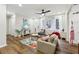 Bright living room featuring hardwood floors, a ceiling fan, and a view to the home's front yard at 1090 Indale Sw Pl, Atlanta, GA 30310