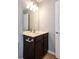 Bathroom features a vanity with storage and a well-lit mirror at 2877 Deerwood Sw Dr, Atlanta, GA 30331