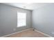 Comfortable bedroom with a window bringing in natural light and neutral carpet flooring at 2877 Deerwood Sw Dr, Atlanta, GA 30331