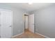 Cozy bedroom with neutral walls, carpet, and white doors, creating a clean and comfortable space at 2877 Deerwood Sw Dr, Atlanta, GA 30331