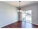 Dining area showcasing a chandelier and sliding glass doors to the outside at 2877 Deerwood Sw Dr, Atlanta, GA 30331