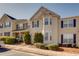 Inviting townhome showcases classic shutters and well-maintained grounds, perfect for a comfortable lifestyle at 2877 Deerwood Sw Dr, Atlanta, GA 30331