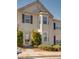 Charming townhome with a bay window and low-maintenance landscaping for easy curb appeal at 2877 Deerwood Sw Dr, Atlanta, GA 30331
