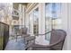 Cozy balcony with tiled flooring, wrought iron railing, and comfortable wicker seating for outdoor relaxation at 3201 Lenox Ne Rd # 16, Atlanta, GA 30324