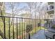 Balcony view overlooking lush greenery and a neighboring building, offering a serene outdoor space at 3201 Lenox Ne Rd # 16, Atlanta, GA 30324