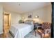 Cozy bedroom with neutral color scheme and hardwood floors, featuring a classic leather chair at 3201 Lenox Ne Rd # 16, Atlanta, GA 30324