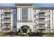 Exterior view of building highlighting architectural details, balconies, and landscaped entrance at 3201 Lenox Ne Rd # 16, Atlanta, GA 30324