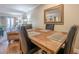A dining room features a wooden table with seating, flowing into an open floor plan at 3201 Lenox Ne Rd # 16, Atlanta, GA 30324