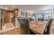 Cozy dining area with a rustic wood table and seating for four next to an open concept kitchen at 3201 Lenox Ne Rd # 16, Atlanta, GA 30324