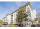 Low angle exterior showing condo building with balconies and lush landscaping at 3201 Lenox Ne Rd # 16, Atlanta, GA 30324