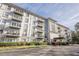 Exterior view of the well maintained condominium building with manicured landscaping and covered entrance at 3201 Lenox Ne Rd # 16, Atlanta, GA 30324