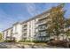 Exterior shot of the condominium building with private balconies, manicured landscaping and driveway at 3201 Lenox Ne Rd # 16, Atlanta, GA 30324