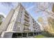Beautiful condominium building with covered parking and multiple balconies on a sunny day at 3201 Lenox Ne Rd # 16, Atlanta, GA 30324
