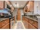 Updated kitchen featuring wood cabinets, stainless steel appliances, and granite countertops at 3201 Lenox Ne Rd # 16, Atlanta, GA 30324