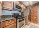 Updated kitchen featuring wood cabinets, stainless steel appliances, and granite countertops at 3201 Lenox Ne Rd # 16, Atlanta, GA 30324
