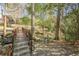 Landscaped common area with walking path, bridge and small stream at 3201 Lenox Ne Rd # 16, Atlanta, GA 30324