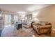 Warm and inviting living room with fireplace, French doors to a balcony, and comfortable seating at 3201 Lenox Ne Rd # 16, Atlanta, GA 30324