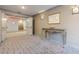 Inviting lobby area with elegant console table, patterned carpeting, and decorative wall sconces at 3201 Lenox Ne Rd # 16, Atlanta, GA 30324