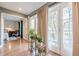 Sun room with hardwood floors and double doors leading to a balcony, adjacent to a bedroom at 3201 Lenox Ne Rd # 16, Atlanta, GA 30324