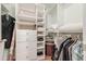 Organized walk-in closet featuring custom shelving, drawers, and ample hanging space for clothing and accessories at 3201 Lenox Ne Rd # 16, Atlanta, GA 30324
