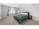 Bedroom featuring a large window with curtains and a large bed at 100 Annes Ln, Sharpsburg, GA 30277