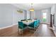 Elegant dining room featuring a long table with stylish velvet chairs and modern decor at 100 Annes Ln, Sharpsburg, GA 30277
