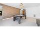 Spacious game room with a pool table and wood accent wall at 100 Annes Ln, Sharpsburg, GA 30277