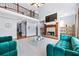 Spacious living room with a fireplace, high ceilings, and a view of the upper level at 100 Annes Ln, Sharpsburg, GA 30277