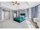 Spacious main bedroom features a canopy bed, sitting area, and double doors that lead to another room at 100 Annes Ln, Sharpsburg, GA 30277