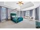 Spacious main bedroom with trey ceiling, a canopy bed, sitting area, and lots of natural light at 100 Annes Ln, Sharpsburg, GA 30277