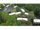 Aerial view showcasing townhome community with lush trees and a swimming pool at 1261 Lavista Ne Rd # M-4, Atlanta, GA 30324