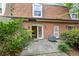 Brick townhouse backyard with a sliding glass door entry to the living area at 1261 Lavista Ne Rd # M-4, Atlanta, GA 30324