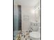 Bathroom showcasing a glass-enclosed shower with gray tile and white vanity, offering a clean and modern style at 1261 Lavista Ne Rd # M-4, Atlanta, GA 30324