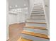 Staircase leading to a spacious living area with newly installed wood-look floors at 1261 Lavista Ne Rd # M-4, Atlanta, GA 30324