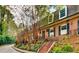 Charming townhomes with brick facade, black shutters, and landscaped front entrances at 1261 Lavista Ne Rd # M-4, Atlanta, GA 30324