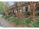 View of brick townhomes with brick steps, wrought iron railings, and mature landscaping at 1261 Lavista Ne Rd # M-4, Atlanta, GA 30324