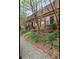 Brick townhomes with inviting entrances, mature trees, and wrought iron railings at 1261 Lavista Ne Rd # M-4, Atlanta, GA 30324