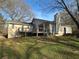 Expansive backyard with a large deck perfect for outdoor entertaining and relaxation in a serene setting at 7503 E Cherokee Dr, Canton, GA 30115