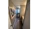 Compact half bathroom with stylish gray walls, modern vanity, and eye-catching floral wall art at 7503 E Cherokee Dr, Canton, GA 30115