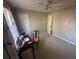 Bedroom featuring a carpeted floor, a ceiling fan, and a work desk under the window at 7503 E Cherokee Dr, Canton, GA 30115