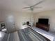 Comfortable bedroom featuring a ceiling fan and ample natural light at 7503 E Cherokee Dr, Canton, GA 30115