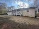 Charming single-story home featuring a welcoming front porch and a well-maintained, spacious front yard at 7503 E Cherokee Dr, Canton, GA 30115