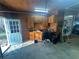 Functional garage space featuring wooden cabinetry, work area, and ample storage for projects and equipment at 7503 E Cherokee Dr, Canton, GA 30115