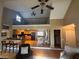 Open floor plan view of kitchen with stainless appliances, dining area, and a loft above at 7503 E Cherokee Dr, Canton, GA 30115