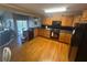 Functional kitchen with ample cabinet space, modern appliances, and hardwood floors, ready for culinary adventures at 7503 E Cherokee Dr, Canton, GA 30115