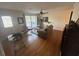 Inviting living room featuring gleaming hardwood floors and natural light at 7503 E Cherokee Dr, Canton, GA 30115